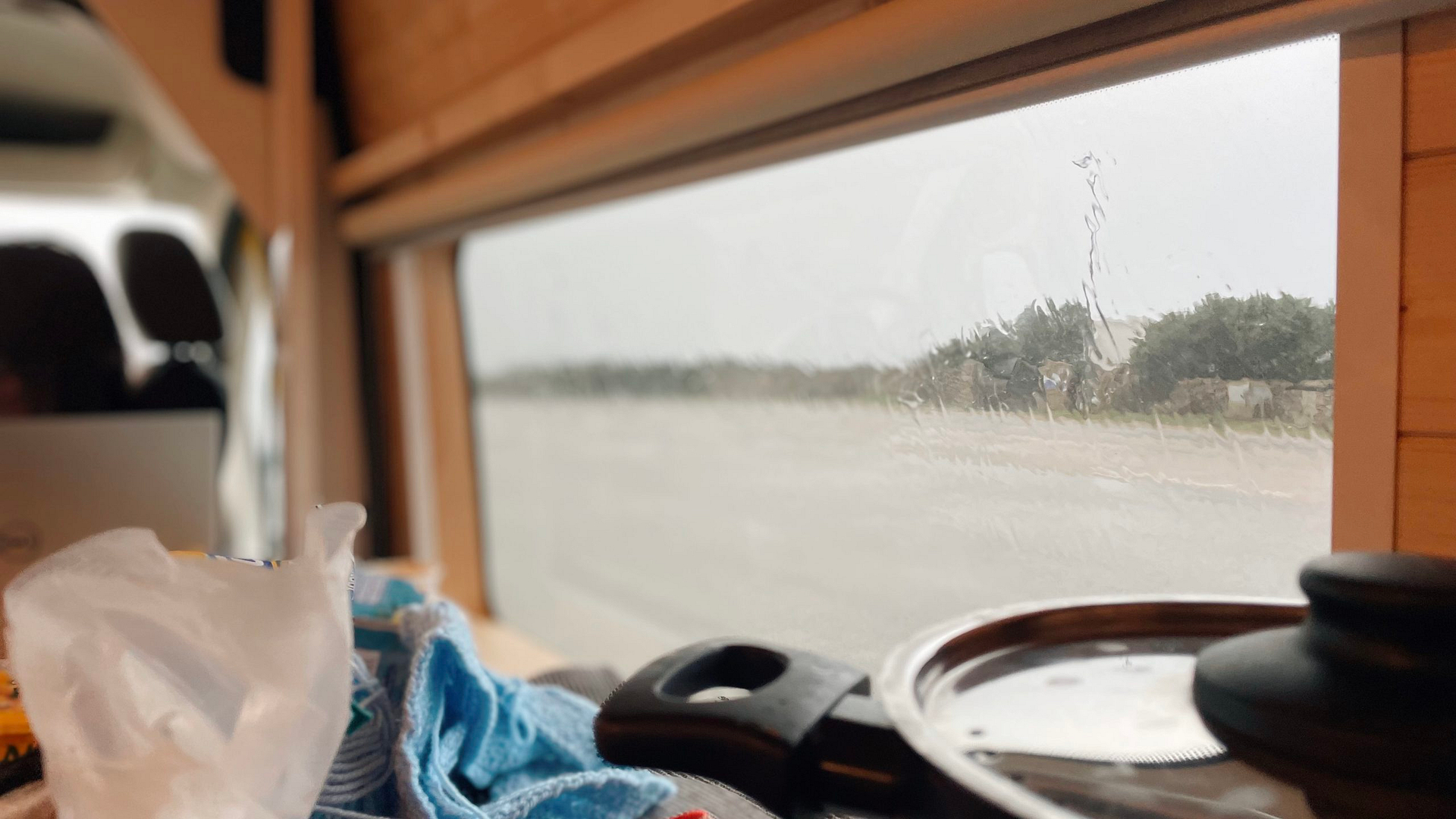 Sitting inside a camper with bad weather