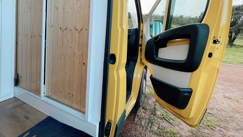 Sliding door for insulation and privacy in a DIY camper