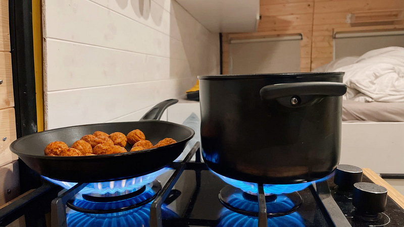 Cooking ware from Ikea on the stove in a camper